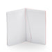 Open blank lined notebook with red accents on white background. 