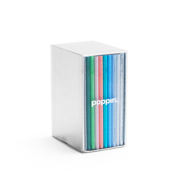 Colorful Poppin notebooks in clear organizer on white background. 