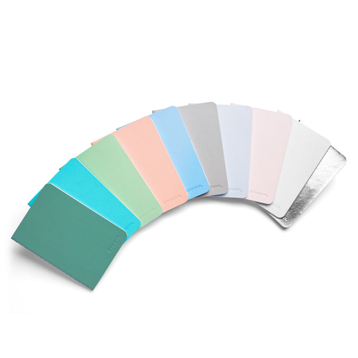 Color swatch palette fanned out on white background, showing gradient of pastel colors. 