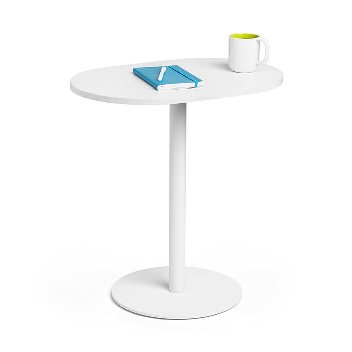 Modern white round side table with a book and a green mug on top against a (25&quot;)