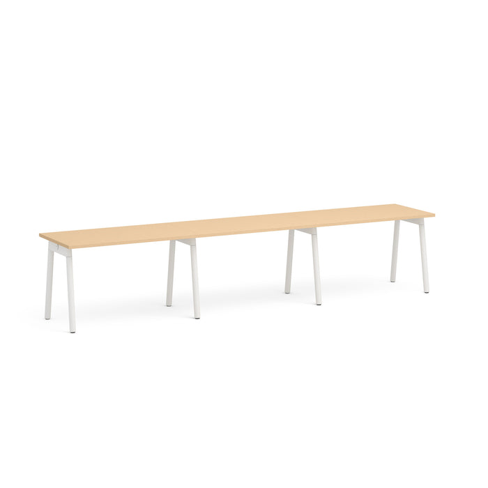 Long minimalist wooden table with white legs on a white background. (Natural Oak-47&quot;)