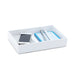 White desk organizer with smartphone, pens, and notebook on white background. (White)