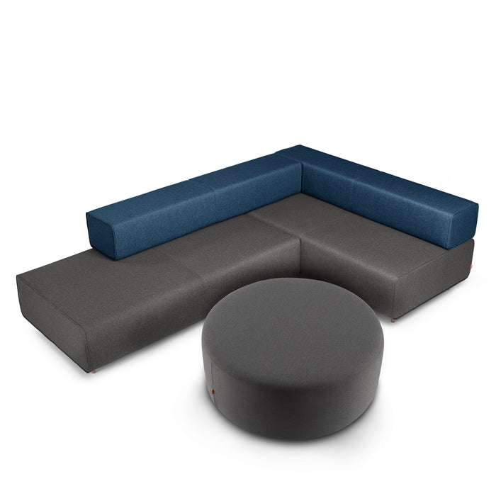 Modern L-shaped sectional sofa with blue cushions and a gray ottoman on white background. (Dark Gray)