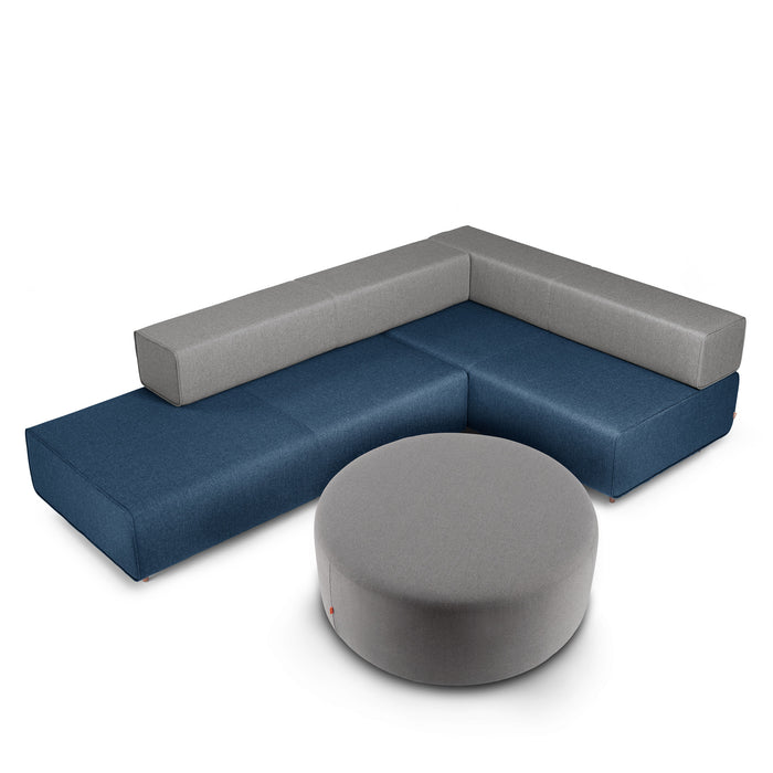 Modern blue L-shaped sectional sofa with gray ottoman on white background. (Gray)