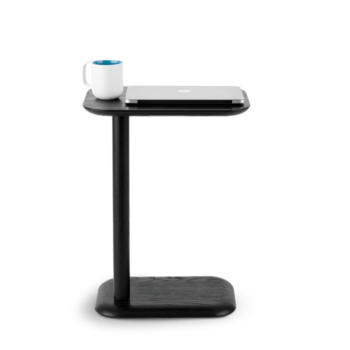 Modern black side table with laptop and coffee mug on white background. (Black)