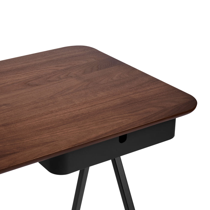Modern walnut wooden desk with black metal legs on a white background. (Walnut)