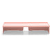 Modern coral pink low-profile coffee table with open shelves on white background. (Blush)