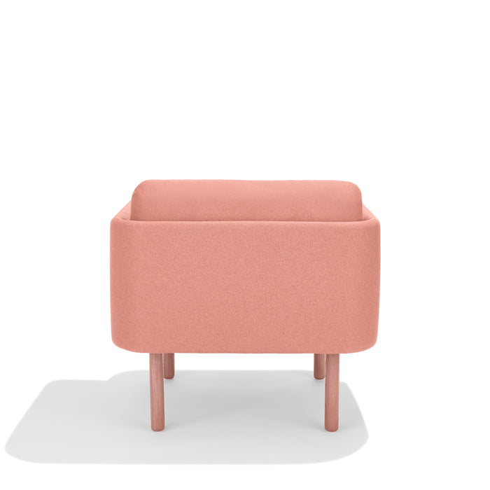 Modern pink armchair with wooden legs on a white background. (Blush)