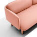 Modern pink fabric sofa with wooden legs on a white background. (Blush)