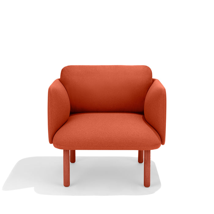Modern red fabric two-seater sofa on a white background. (Brick)