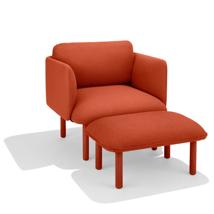 Modern red armchair with matching ottoman on white background (Brick)