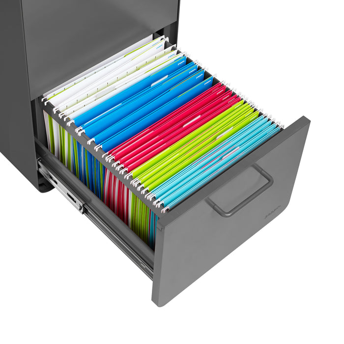 Colorful file folders organized in an open grey filing cabinet drawer. (Charcoal)
