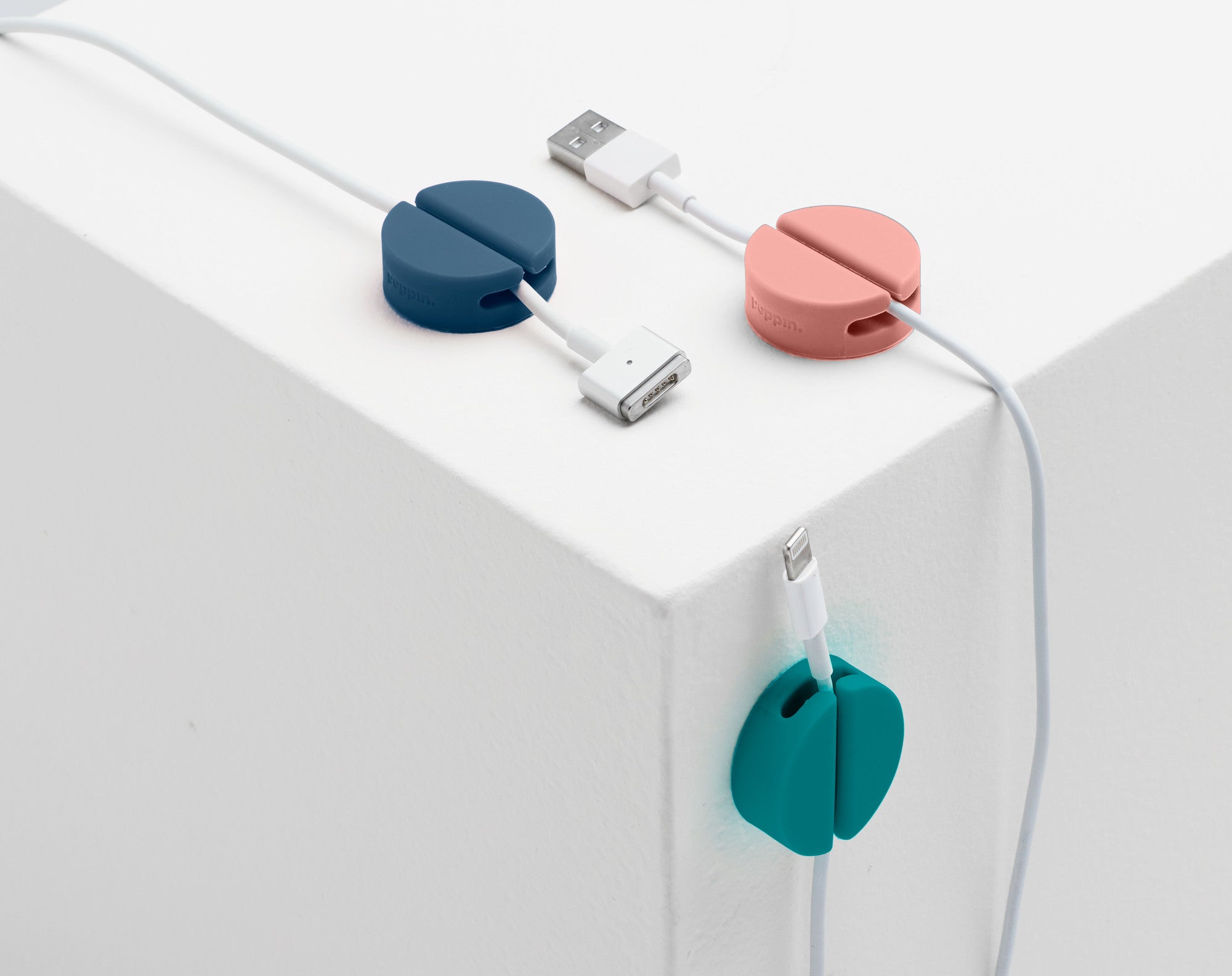 Colorful magnetic cable holders on white background (Contemp. Assorted)