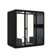 Modern office phone booth with glass door and comfortable seating. (Dark Gray)