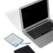Open laptop with notebook and pen on white background. (Elements)