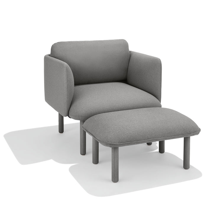 Gray armchair with matching ottoman on a white background. (Gray)
