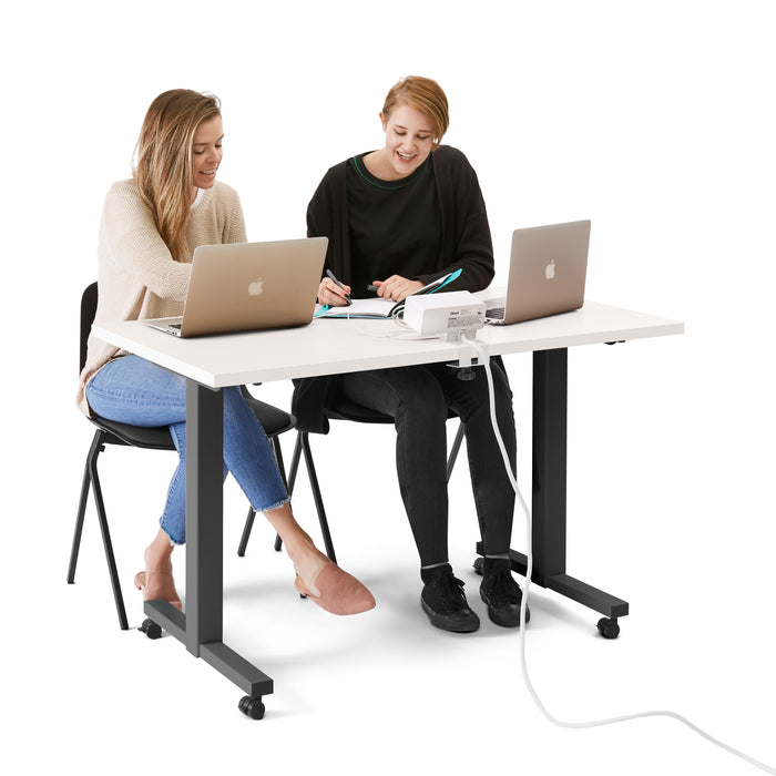 Two colleagues working at a white desk with laptops and taking notes on a white background. (White-57&quot;)