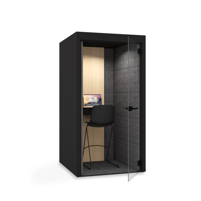 Modern office pod with black exterior, wooden back panel, desk, and chair. (Black)