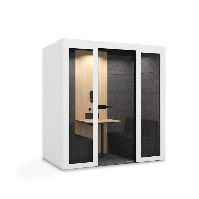 Modern office phone booth with wooden desk and black interior walls. (White)