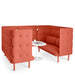 Coral upholstered high-back booth seating with white round table and laptop (Brick-Brick)