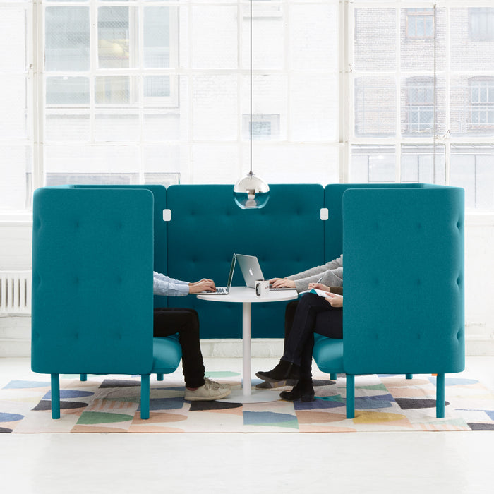 Modern office privacy booth with two people working on a laptop together. (Teal-Teal)