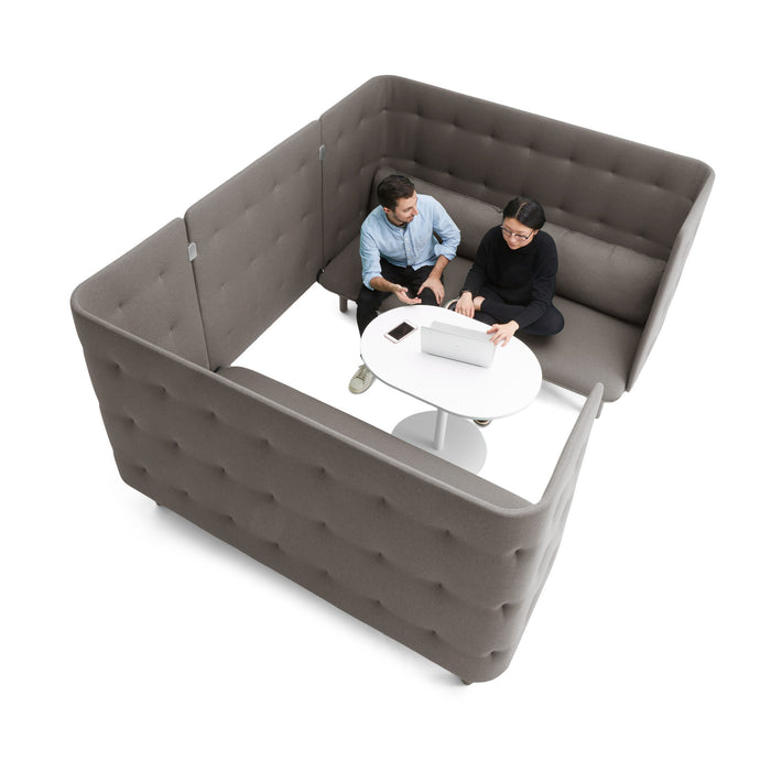 Two professionals having a meeting in a modern, high-back office sofa booth. (Gray-Gray)