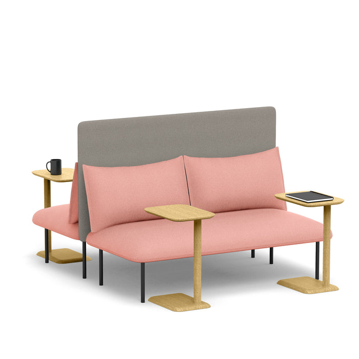 Modern pink sofa with side tables, cushions, and a grey backrest with a cup and tablet. (Blush-Gray)