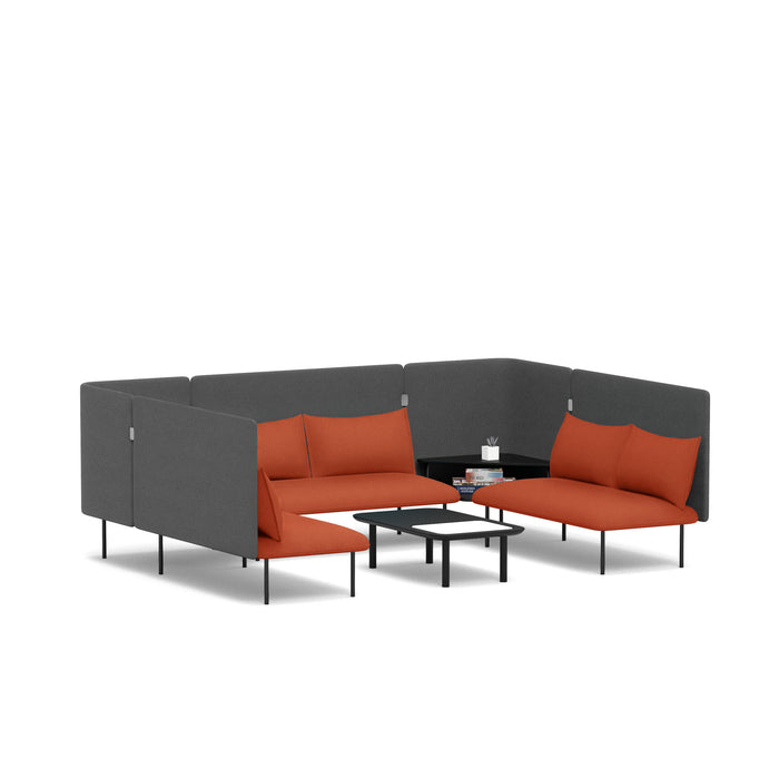 Modern L-shaped sectional sofa in gray with orange cushions and a small coffee table on (Brick-Dark Gray)