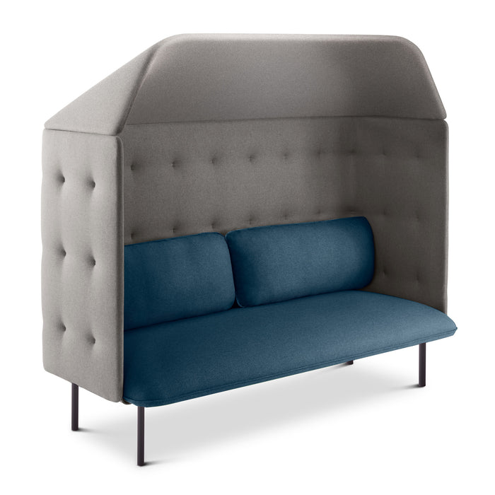 Modern high-back sofa with blue cushions and grey tufted walls on a white background. (Dark Blue-Gray)