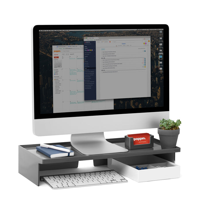 "Modern workspace with organized desk, computer monitor displaying emails, and office supplies." (Dark Gray)