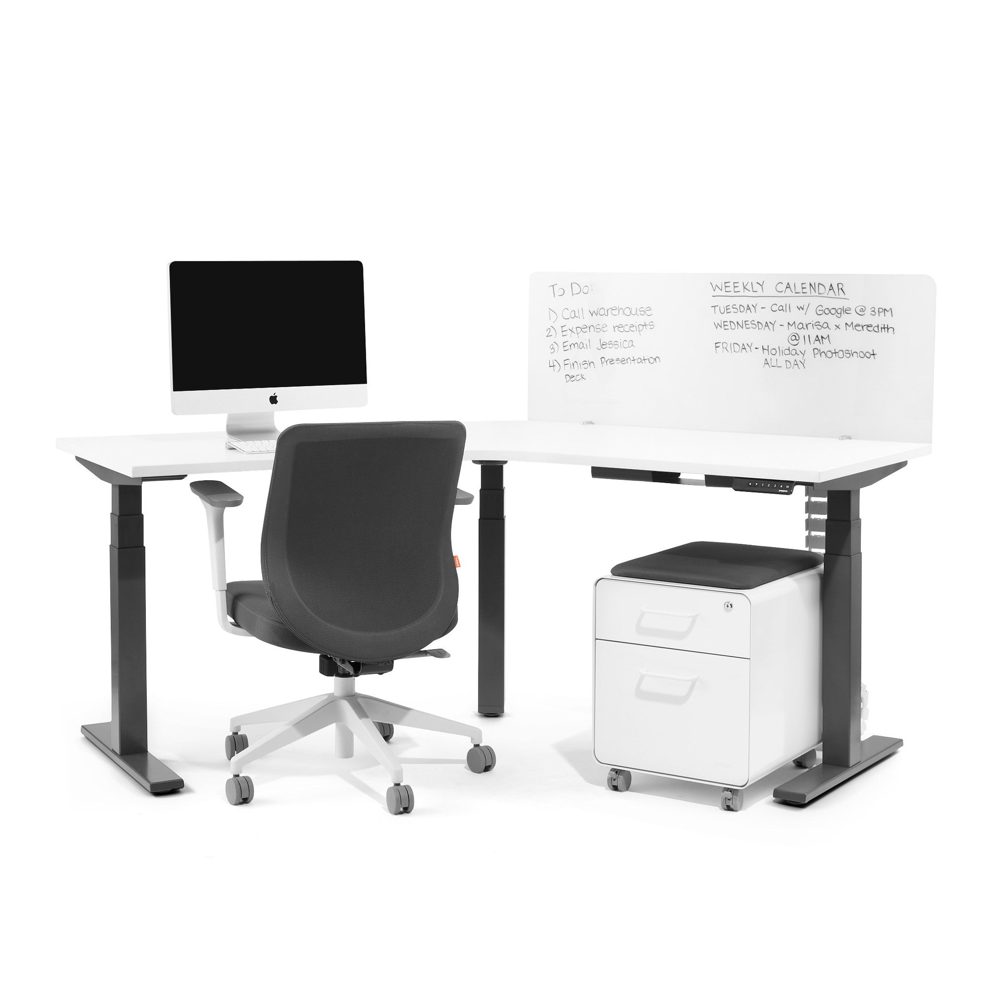 Modern home office setup with adjustable desk, computer, chair, and whiteboard. (45&quot;)(55&quot;)