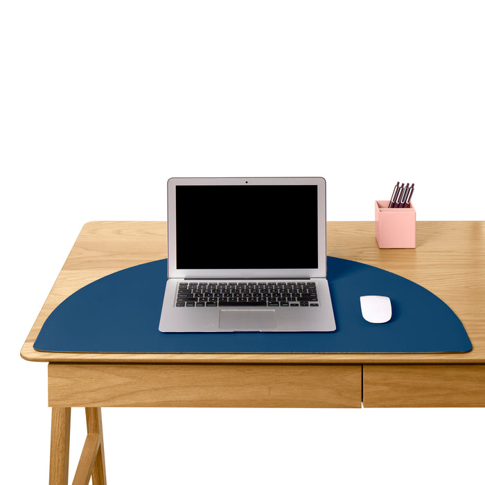 Modern workspace with laptop, mouse, and stationery holder on a wooden desk with a blue mat (Slate Blue)