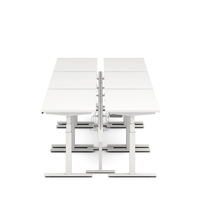 Modern dual sit-stand desks with white surfaces and adjustable frames on a white background. (White-180&quot;)