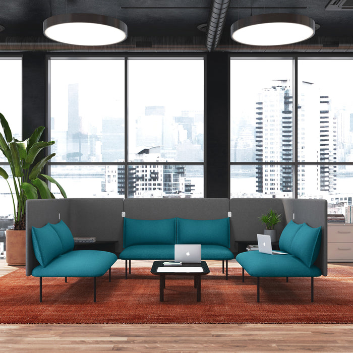 Modern office lounge with teal sofas, black table, laptop, and city view. (Dark Gray-Dark Gray)(Brick-Dark Gray)(Dark Blue-Dark Gray)(Teal-Dark Gray)(Gray-Gray)(Blush-Gray)(Brick-Gray)(Dark Blue-Gray)