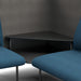 Modern office corner with black table and blue chairs on a textured carpet. (Dark Blue-Dark Gray)