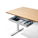 Modern office desk with open storage drawer on white background. (White)