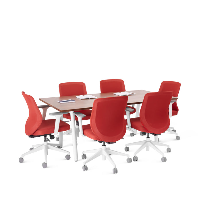 Modern conference room with red chairs and a wooden table on a white background. (Walnut-72&quot; x 36&quot;)