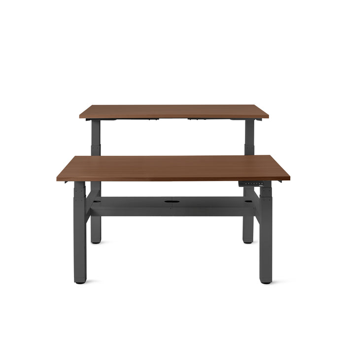 Modern adjustable standing desk with wooden tabletop and black frame on a white background. (Walnut-47&quot;)