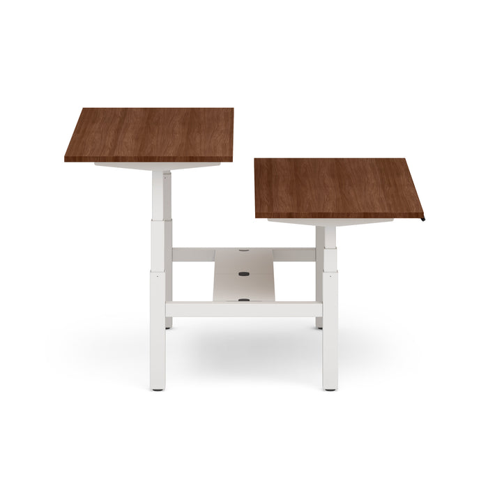 Adjustable height desk with walnut finish and white legs on a white background. (Walnut-60&quot;)