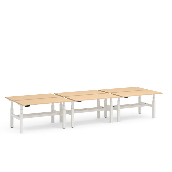 Three beige office desks with white legs arranged in a row on a white background. (Natural Oak-57&quot;)