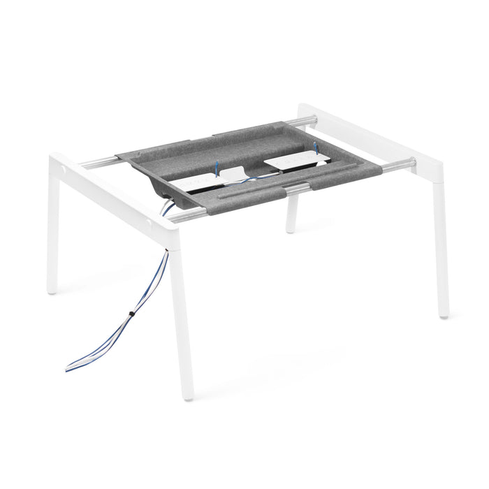 White height-adjustable desk with gray fabric under-desk management tray and cable organizers. (Desk for 2)