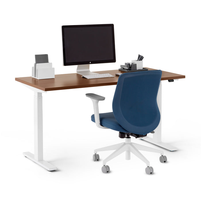 Modern office desk setup with computer monitor and blue chair on white background. (Walnut-57&quot;)