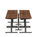 Modern height-adjustable desk with wooden top and black frame on white background. (Walnut-57&quot;)