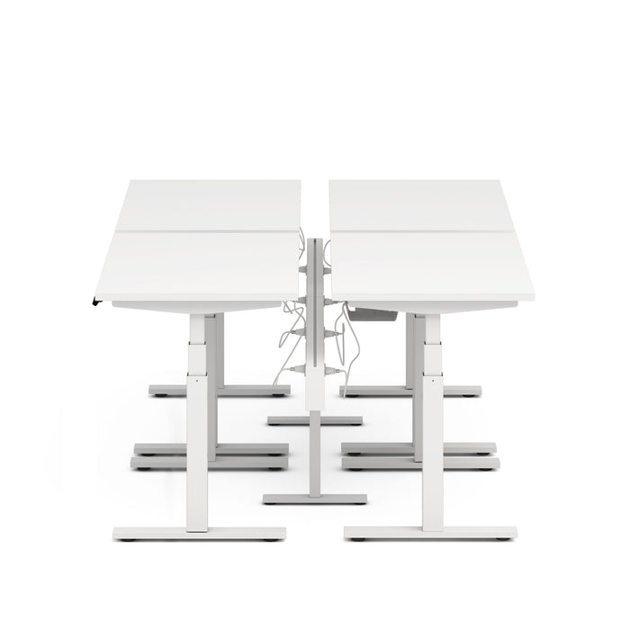 Modern white height-adjustable desks on a white background. (White-47&quot;)