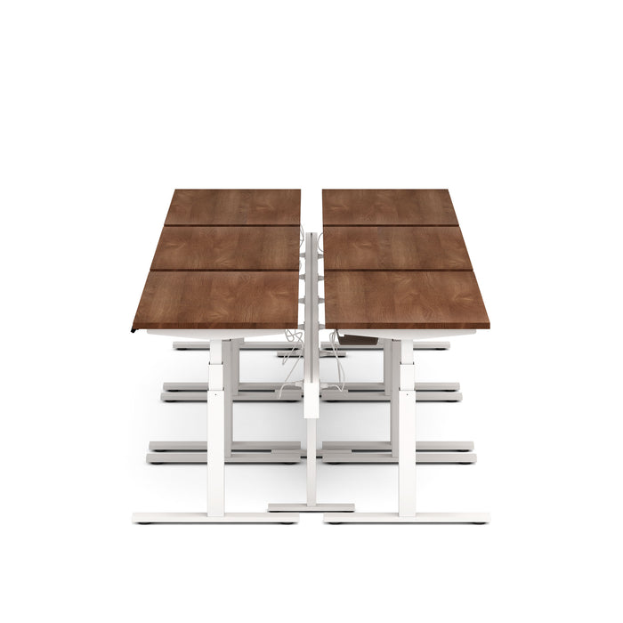 Modern brown wooden table with white metal frame on a white background. (Walnut-47&quot;)