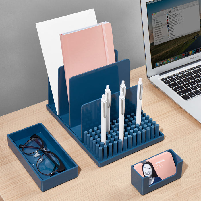 Organized desk with laptop, stationery holder, pen stand, and glasses on wooden table. (Slate Blue)