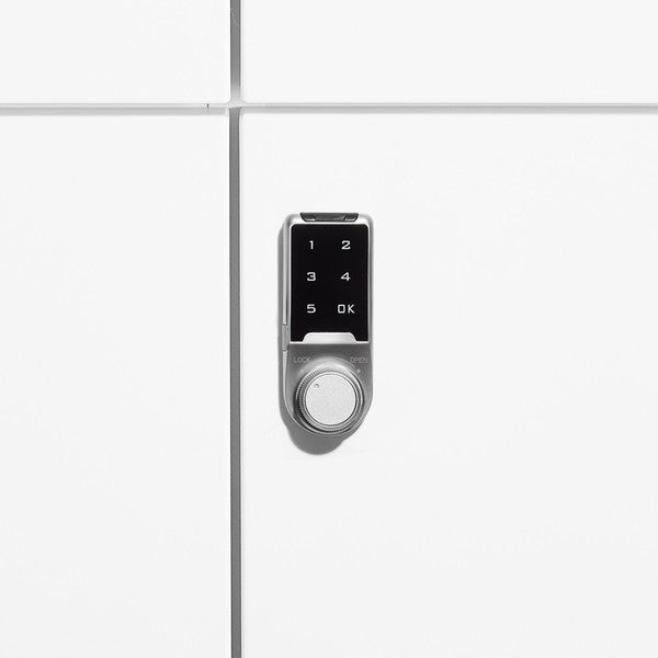 Digital keypad lock on a white door for secure access. (White)