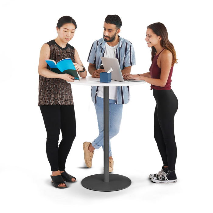 Three young adults collaborating over a book and laptop at a standing desk (White-Charcoal)