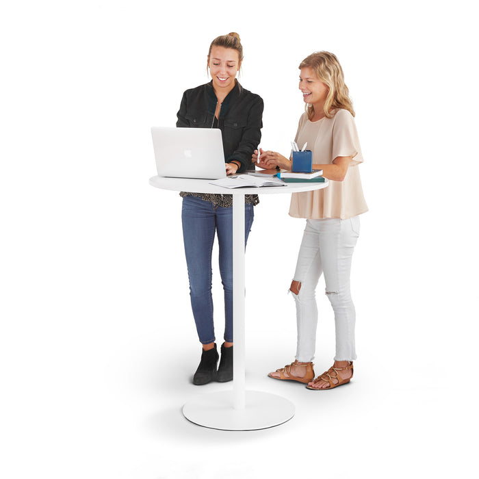 Two women standing and working together at a modern white stand-up desk with a laptop. (White-White)