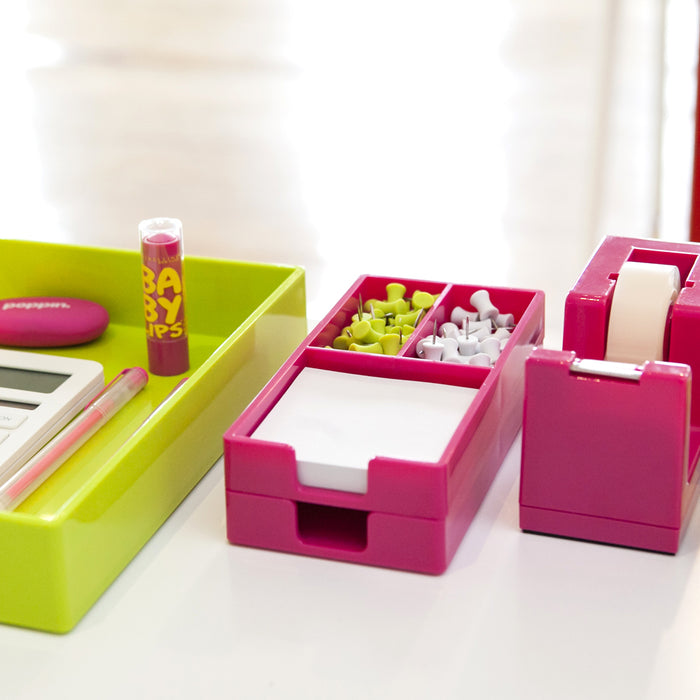 Colorful desk organizers with office supplies on a white table. (White)